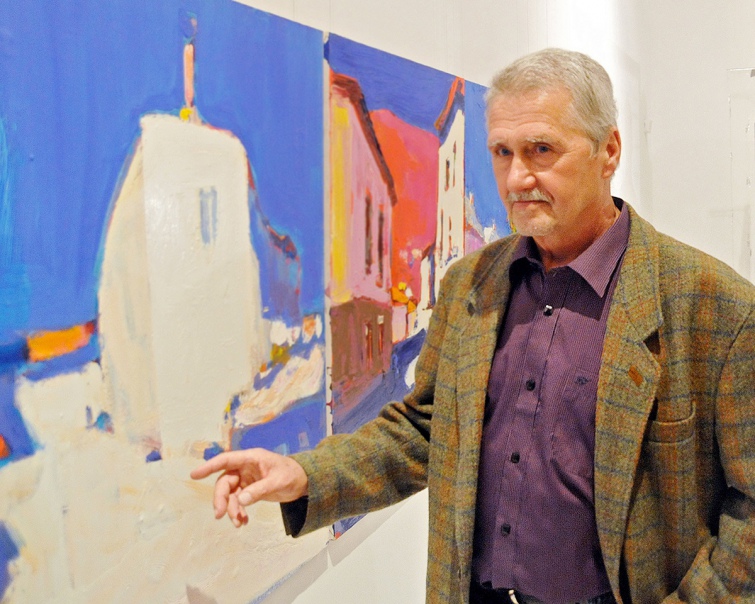 The photo of the Ukrainian artist Anatoliy Kryvolap in front of his painting.; Anatoliy Kryvolap