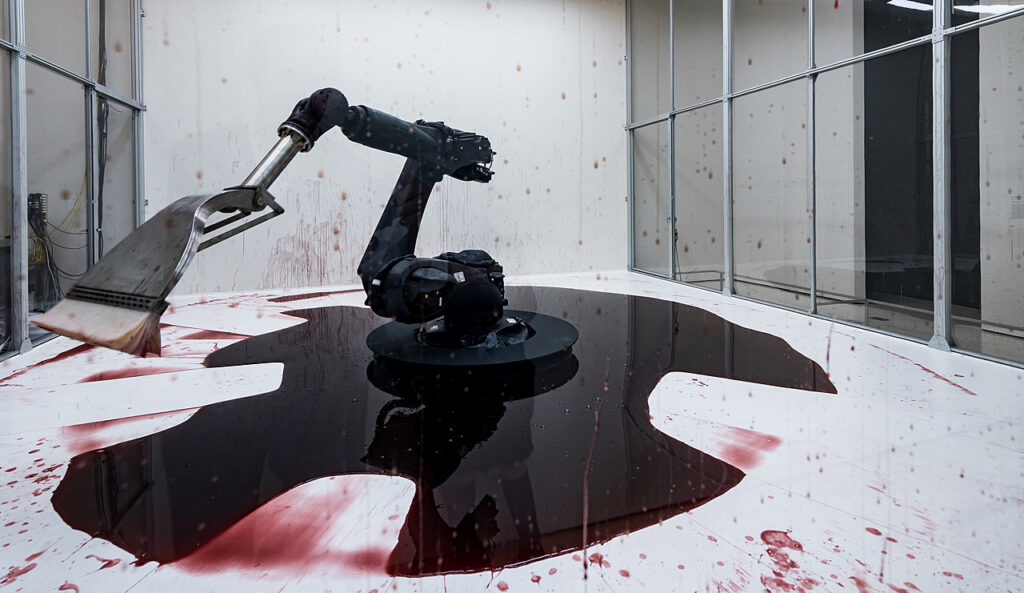 Blood in art: Sun Yuan and Peng Yu, Can’t Help Myself, 2016, kuka industrial robot, stainless steel and rubber, cellulose ether in colored water, lighting grid with Cognex visual-recognition sensors, and polycarbonate wall with an aluminum frame, dimensions variable overall, Solomon R. Guggenheim Museum, New York City, USA.
