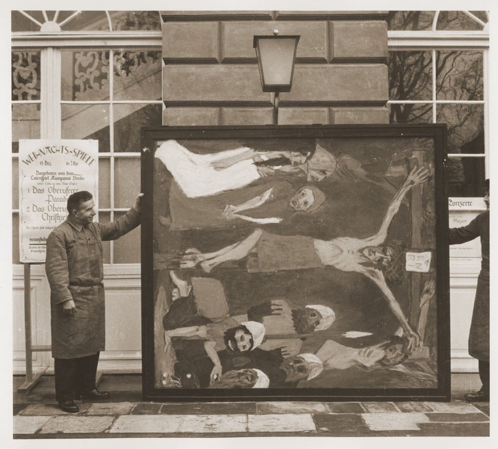 Degenerate Art exhibition: Art handlers at the Schloss Niederschoenhausen storage depot hold a section of Emil Nolde’s confiscated Das Leben Christi in 1937. Photo: US Holocaust Memorial Museum.
