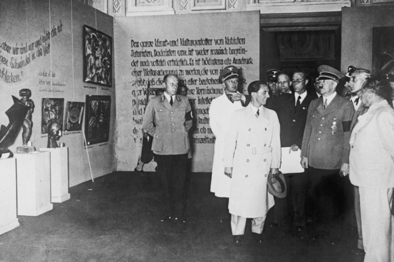 Degenerate Art exhibition: Adolf Hitler and the Minister of Propaganda, Joseph Goebbels, visit the Degenerate Art exhibition on July 16, 1937. Bundesarchiv.
