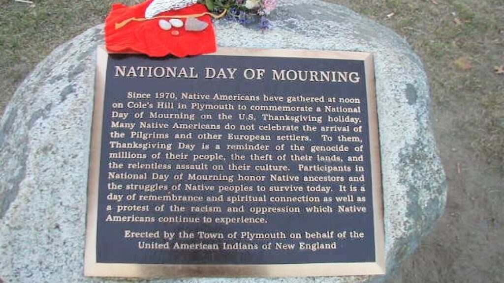 real history of Thanksgiving: Memorial plaque for the National Day of Mourning in Plymouth. Photograph by Nicole S./UAINE. Governing.
 
