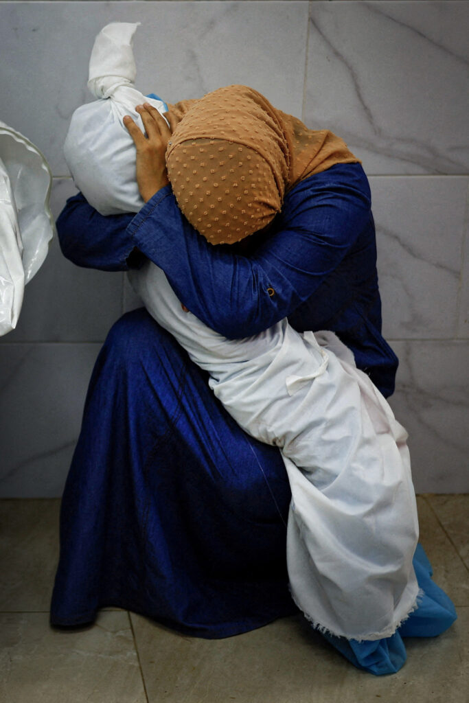 World Press Photo: Mohammed Salem, A Palestinian Woman Embraces the Body of Her Niece, Reuters. 2024 Photo Contest, World Press Photo of the Year. World Press Photo.
