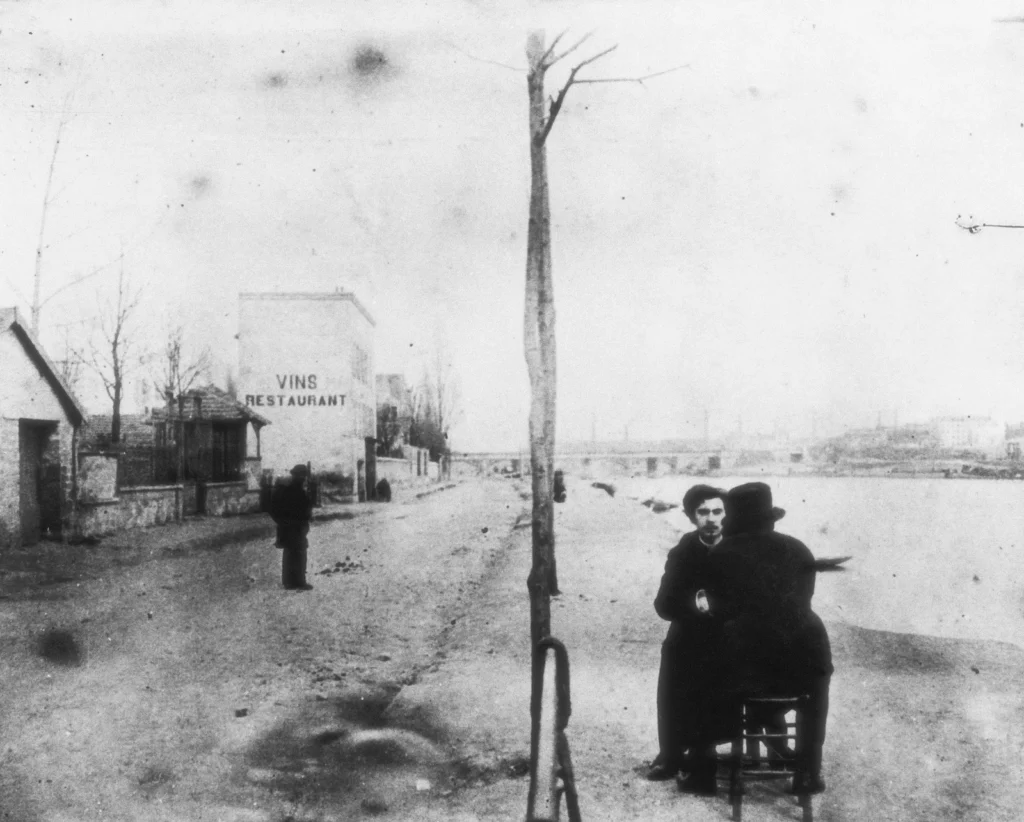 A Fire In His Soul: Vincent (seen from behind) and Emile Bernard by the River Seine at Asnières, near Paris, c. 1886. Van Gogh Museum, Amsterdam, Netherlands. Museum’s website.
